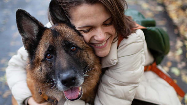 Woman hugging a German Shepherd