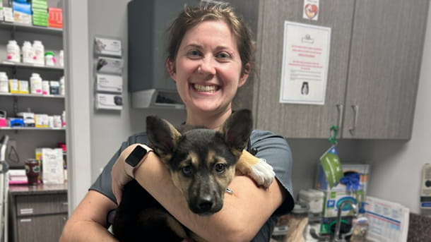 Dr. Goins holding a puppy